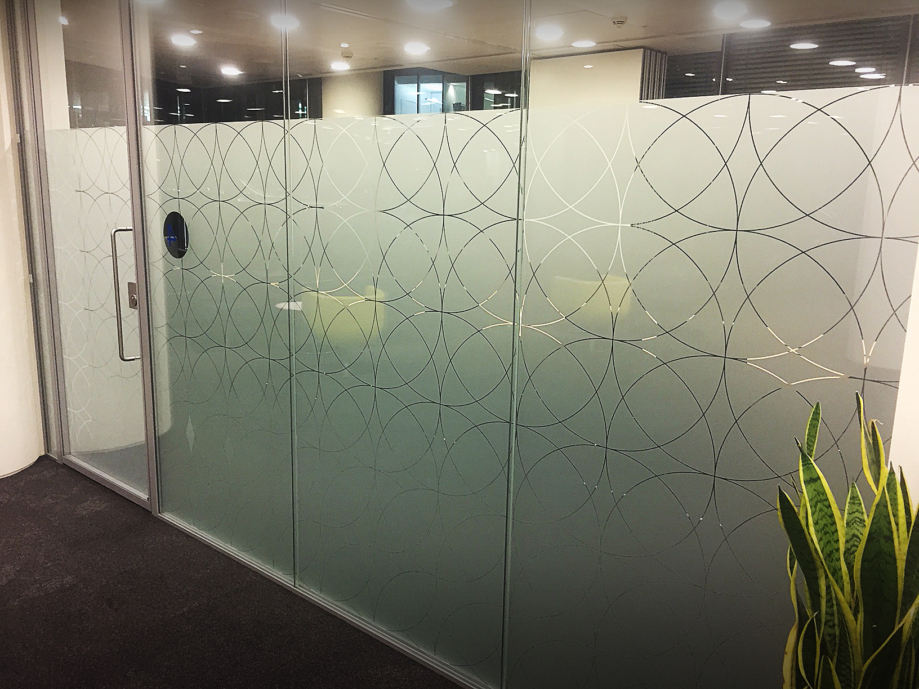 A glass wall and door in the Womble Bond Dickinson office in London
