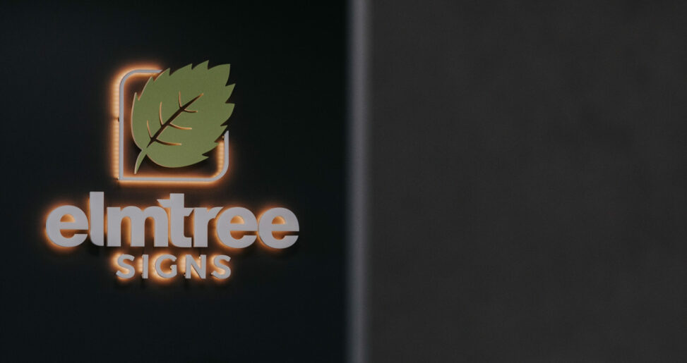 An image of the original elmtree LED sign on a black wall